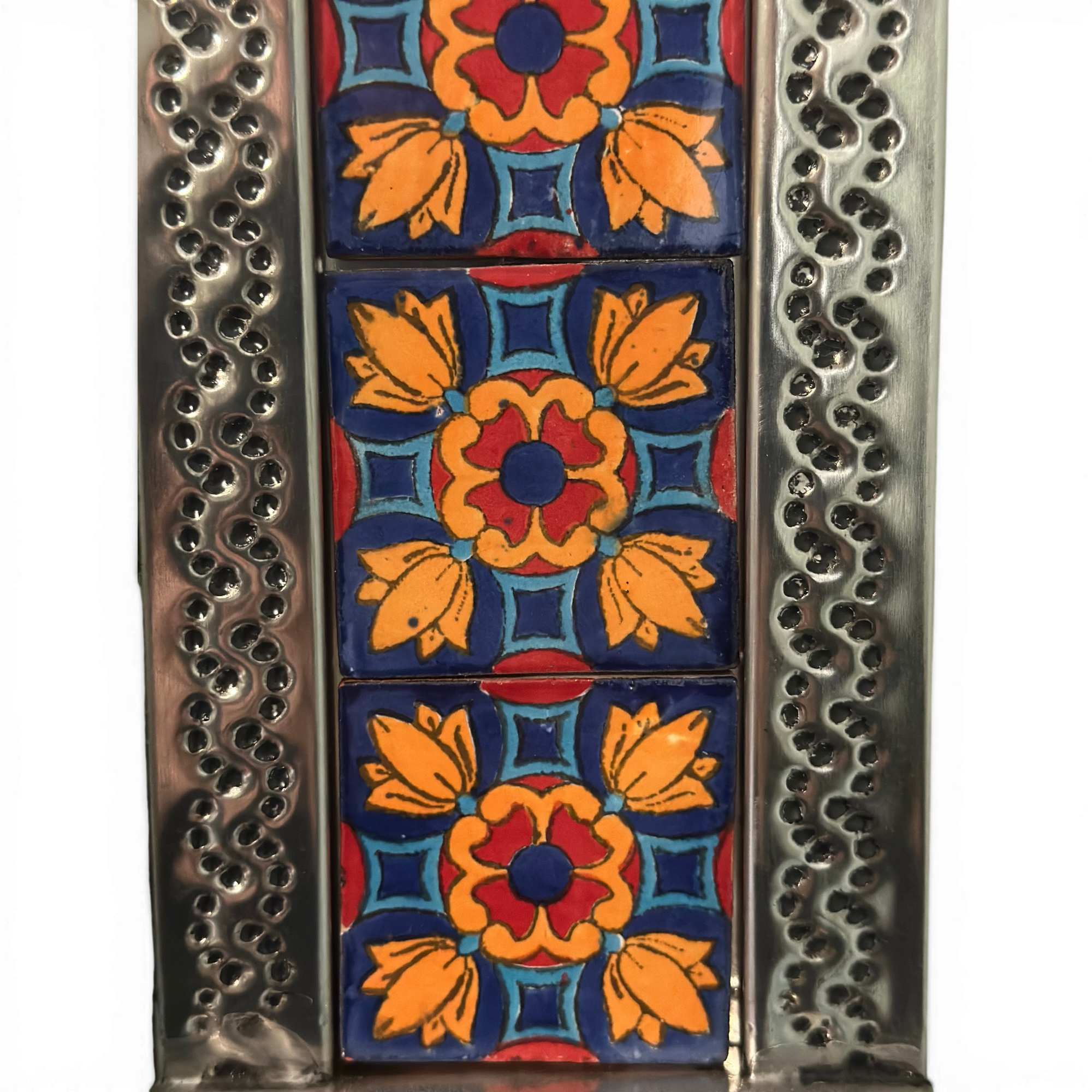 Close-up of hand-painted Talavera ceramic tiles on handcrafted Mexican wall mirror showing intricate floral patterns and vibrant colors