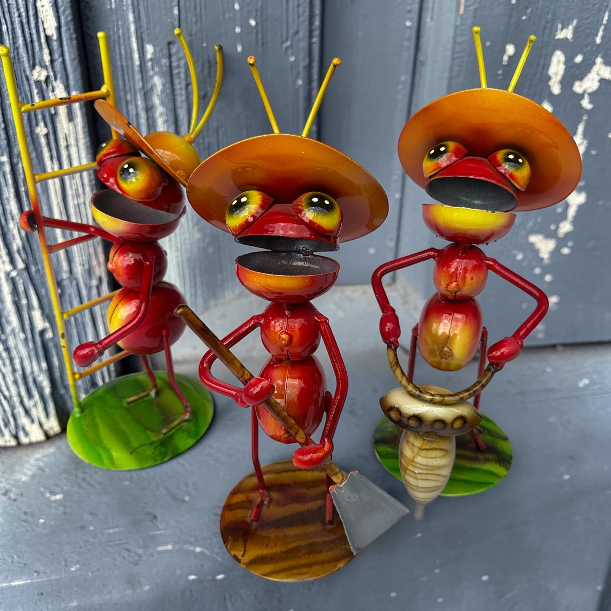 Hand-painted metal working ants from Mexico — set of three garden sculptures with construction tools and oversized sombrero hats