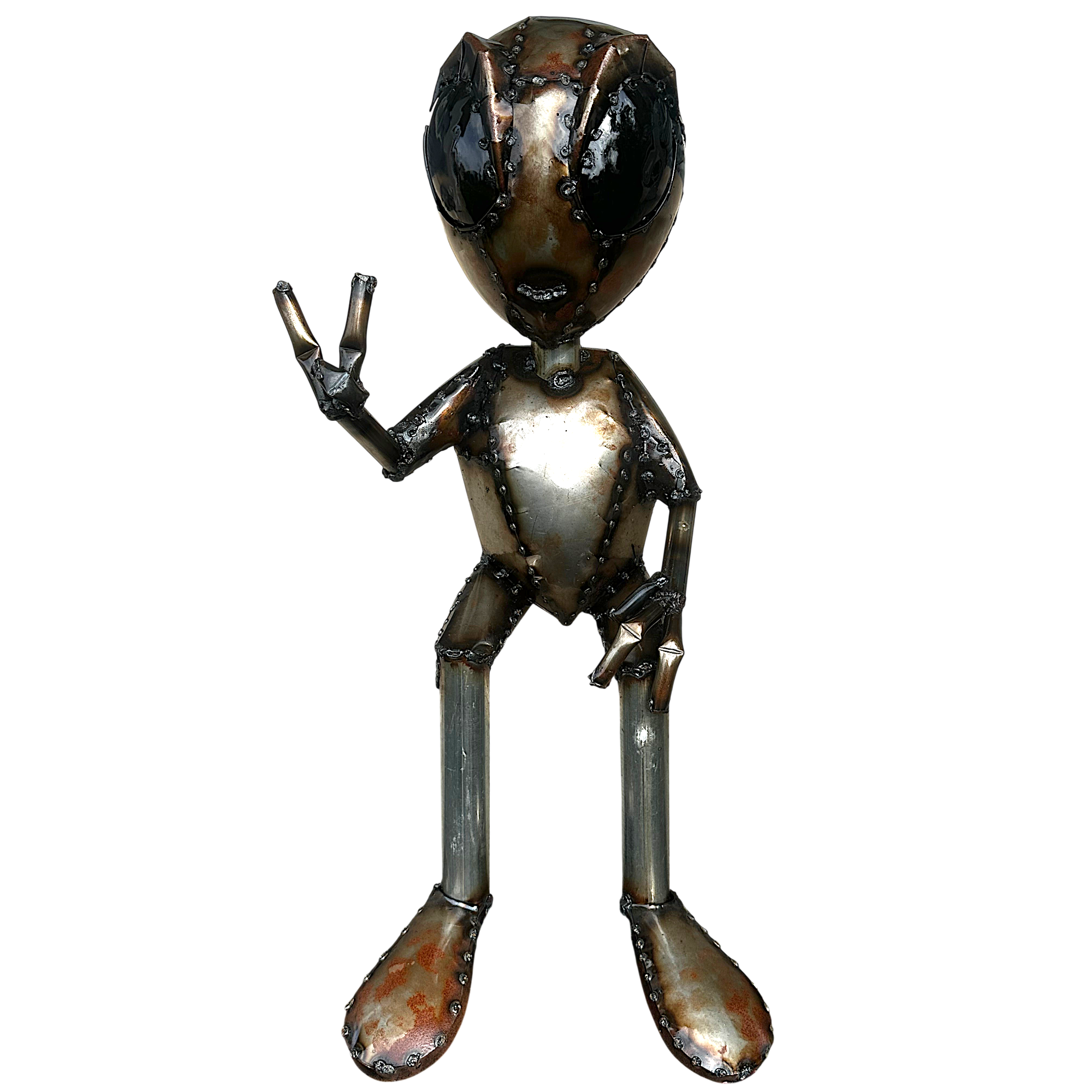 Handcrafted metal alien sculpture making peace sign on white background