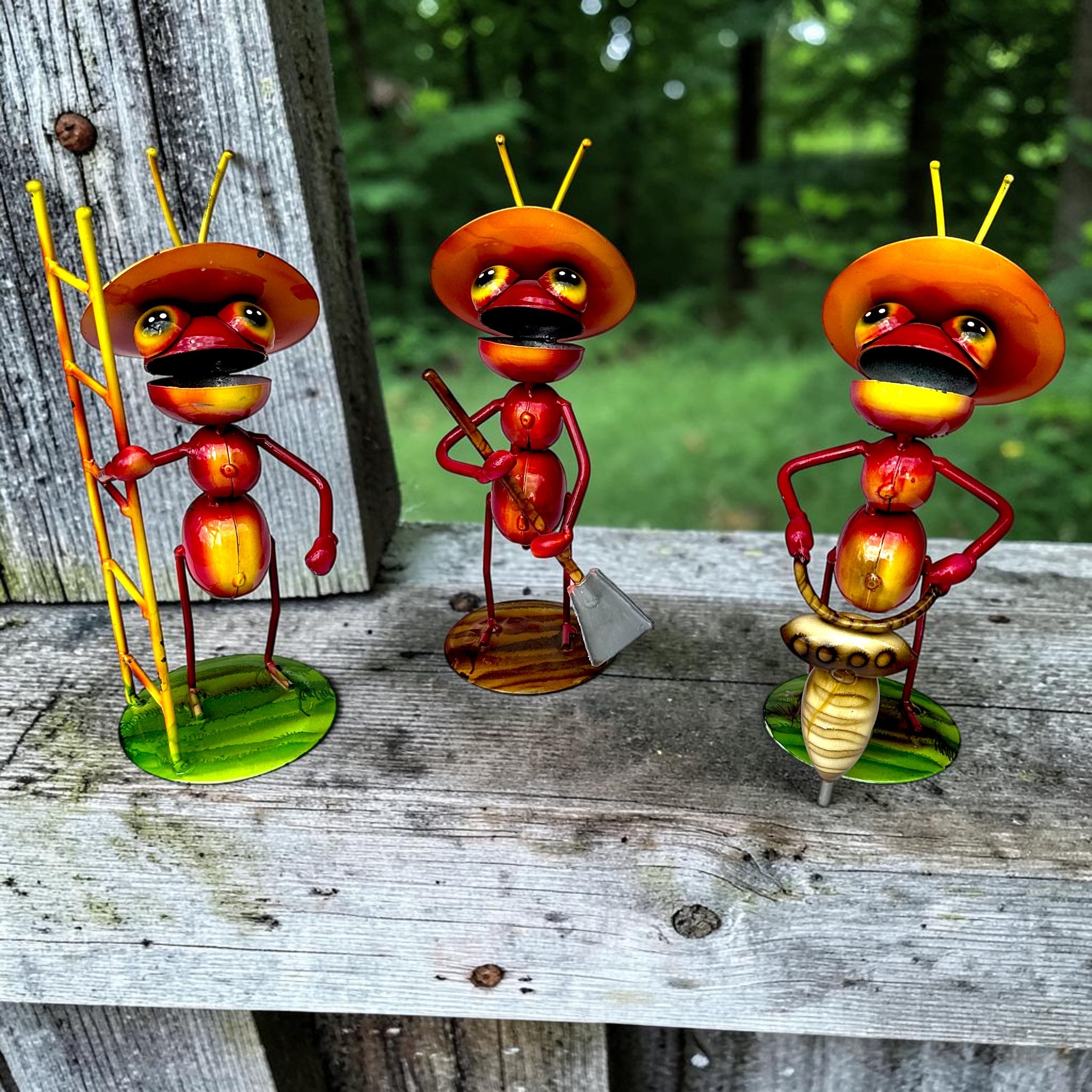 Three whimsical Mexican folk art ant sculptures with construction tools — ladder, shovel, and drill — handmade in Jalisco